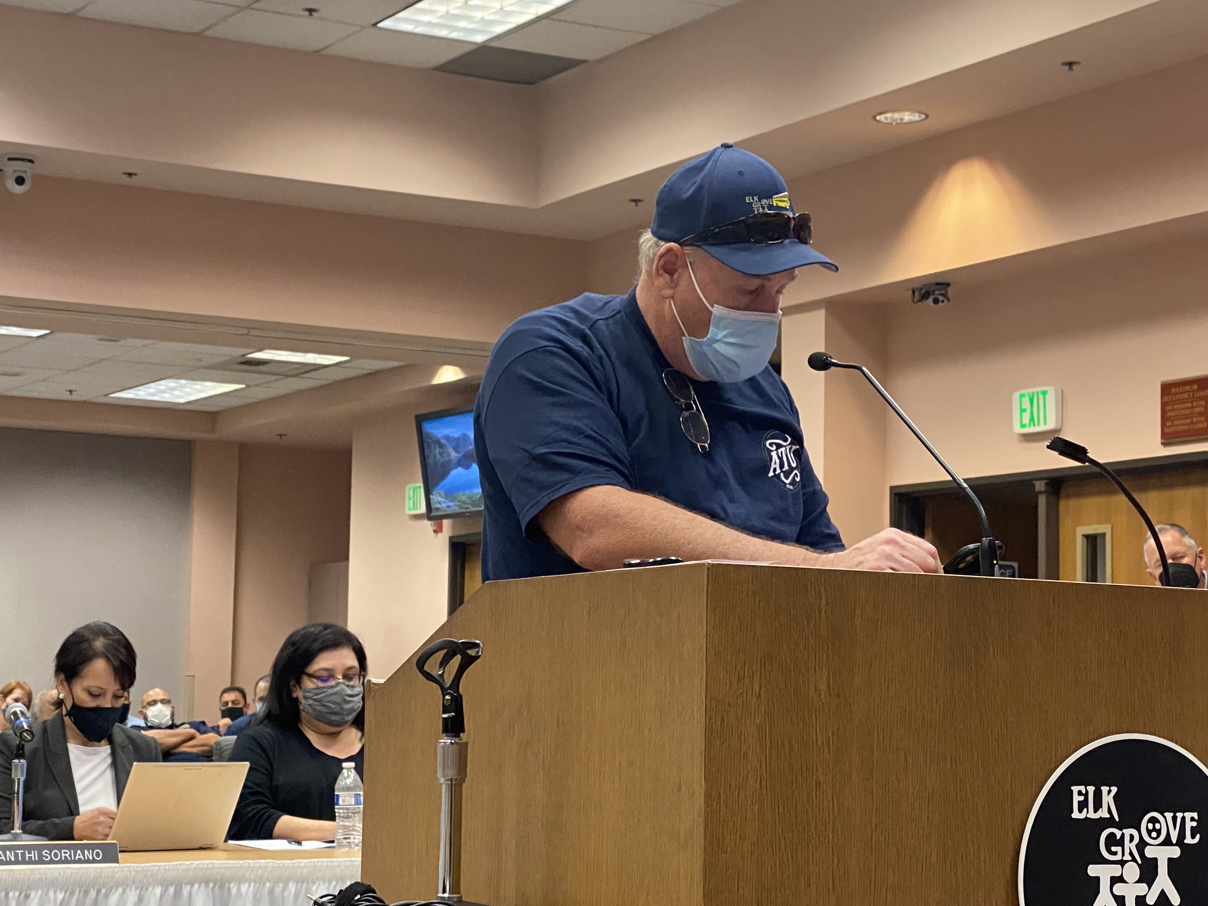 Twin robots mounted behind the bar, about six feet apart, shaped like an 